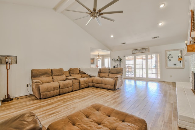 5419 87th St, Lubbock, TX 79424 - living room with ceiling fan, high vaulted ceiling, light wood-style floors, beamed ceiling, and a chandelier