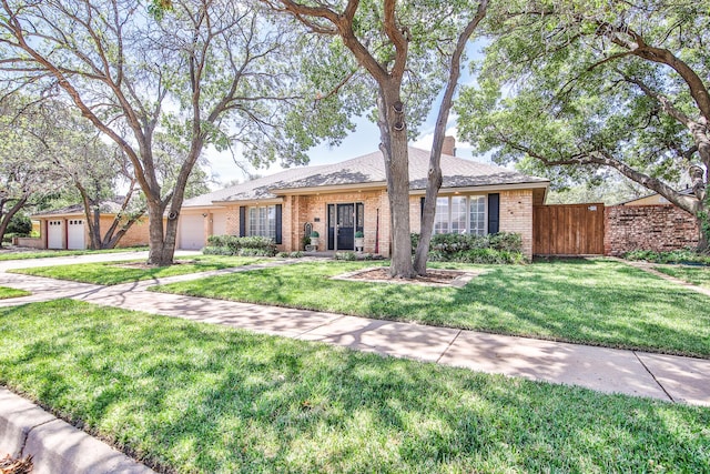 5419 87th St, Lubbock, TX 79424 - single story home featuring an attached garage, brick siding, driveway, and a chimney