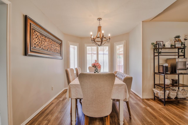 5419 87th St, Lubbock, TX 79424 - dining space featuring a chandelier and wood finished floors