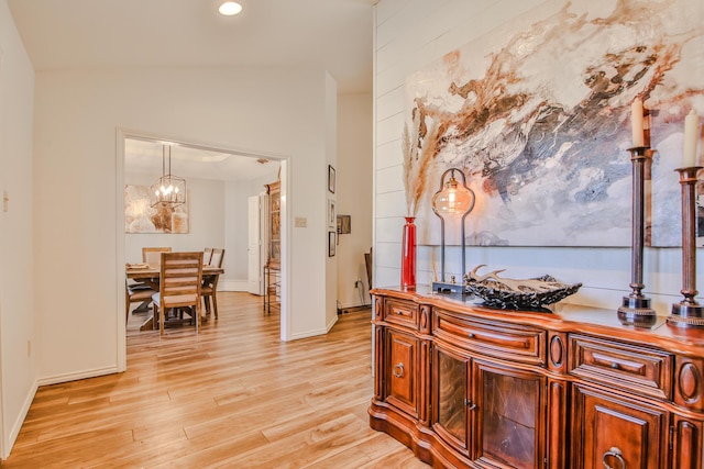 5419 87th St, Lubbock, TX 79424 - hall featuring light wood finished floors, a chandelier, recessed lighting, and vaulted ceiling