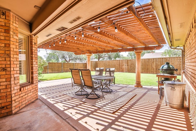 5419 87th St, Lubbock, TX 79424 - fenced backyard featuring a pergola, outdoor dining space, and a patio area