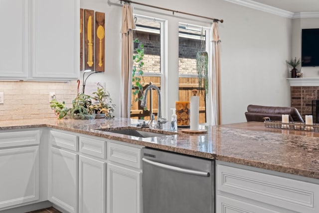 kitchen featuring white cabinetry, sink, crown molding, and dishwasher