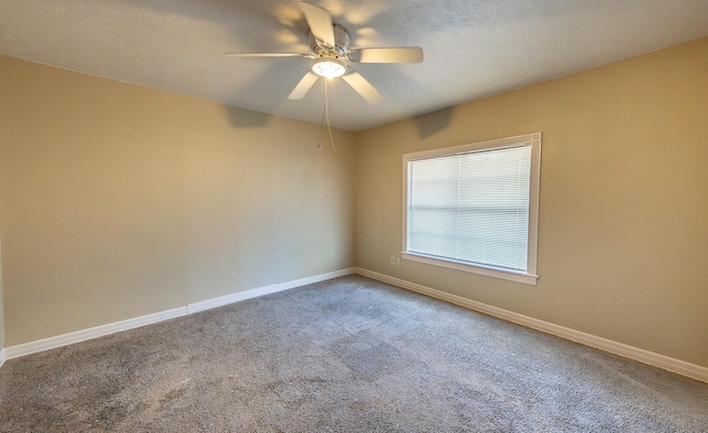 unfurnished room featuring ceiling fan, carpet, and a textured ceiling