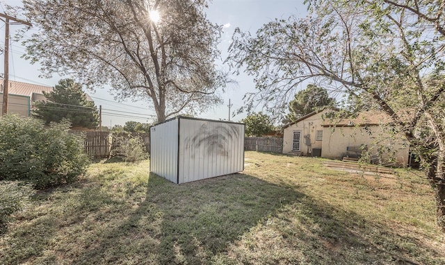 view of outbuilding with a yard