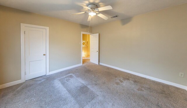 unfurnished bedroom with carpet floors and ceiling fan