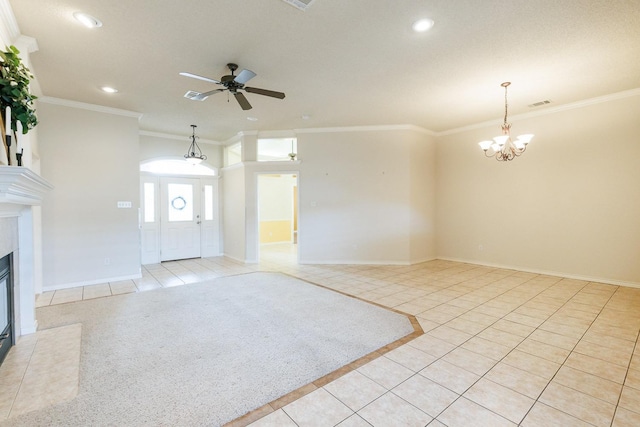 unfurnished living room with light tile patterned floors, crown molding, and ceiling fan with notable chandelier