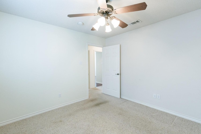 spare room with ceiling fan