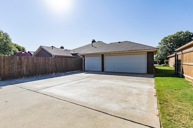 garage with a yard