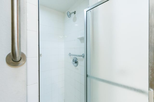 bathroom featuring an enclosed shower