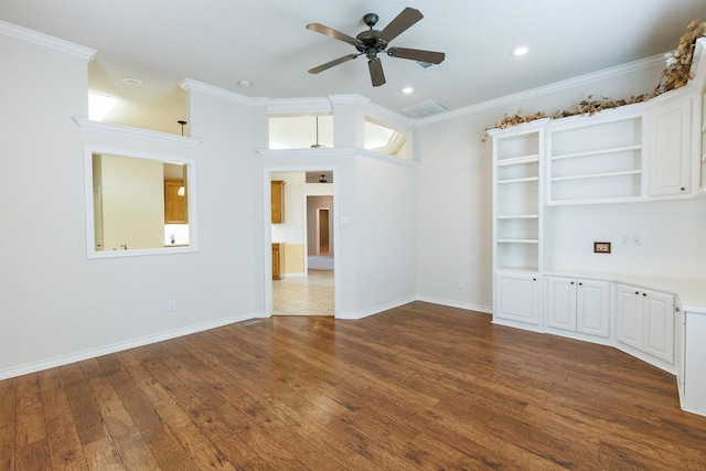 interior space with a high ceiling, crown molding, hardwood / wood-style floors, and ceiling fan