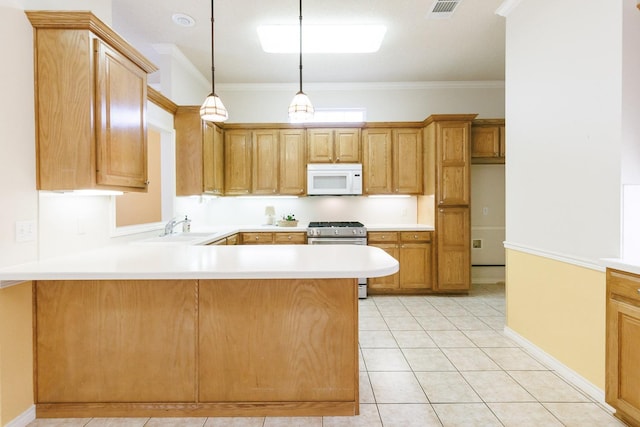 kitchen with sink, decorative light fixtures, ornamental molding, kitchen peninsula, and high end stainless steel range oven