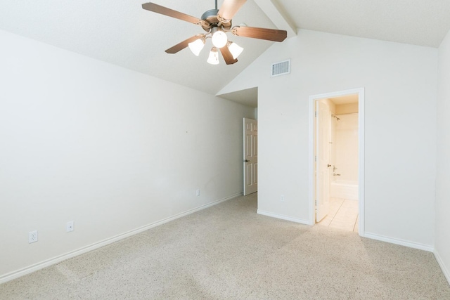 unfurnished bedroom featuring light colored carpet, ensuite bath, lofted ceiling with beams, and ceiling fan