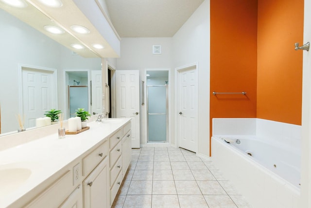 bathroom with vanity, independent shower and bath, and tile patterned flooring