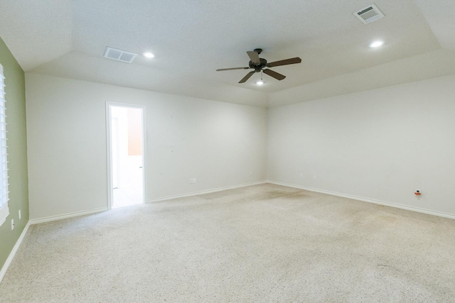 carpeted empty room with vaulted ceiling and ceiling fan