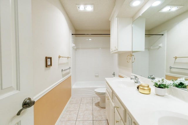 full bathroom with tile patterned flooring, vanity, shower / tub combination, and toilet