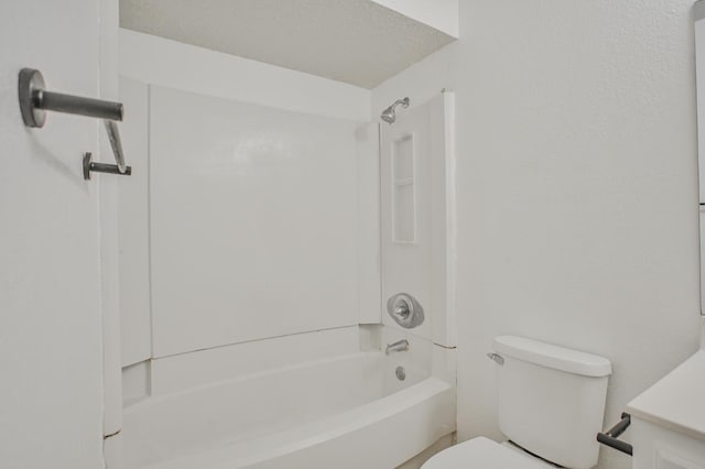 full bathroom with vanity, washtub / shower combination, and toilet