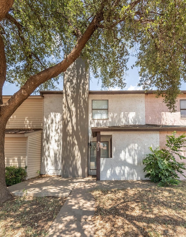 rear view of property featuring a patio