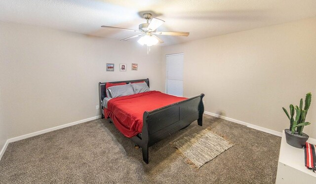 bedroom with ceiling fan and carpet