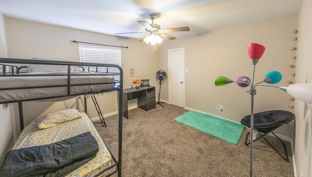 bedroom featuring ceiling fan and carpet