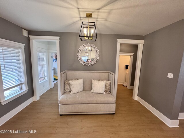 9906 Uvalde Ave, Lubbock, TX 79423 - sitting room with wood finished floors