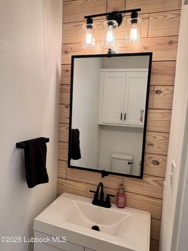 9906 Uvalde Ave, Lubbock, TX 79423 - bathroom with vanity and decorative backsplash