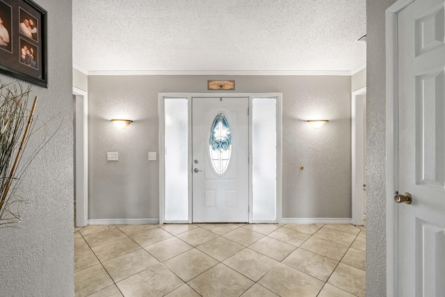 foyer featuring crown molding, light tile patterned floors, and a textured ceiling