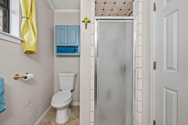 bathroom featuring walk in shower, tile patterned floors, toilet, and crown molding