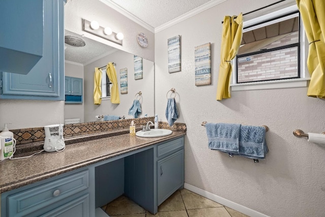 bathroom with vanity, ornamental molding, and a textured ceiling