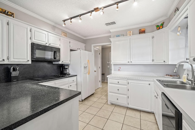 kitchen featuring sink, black appliances, and white cabinets