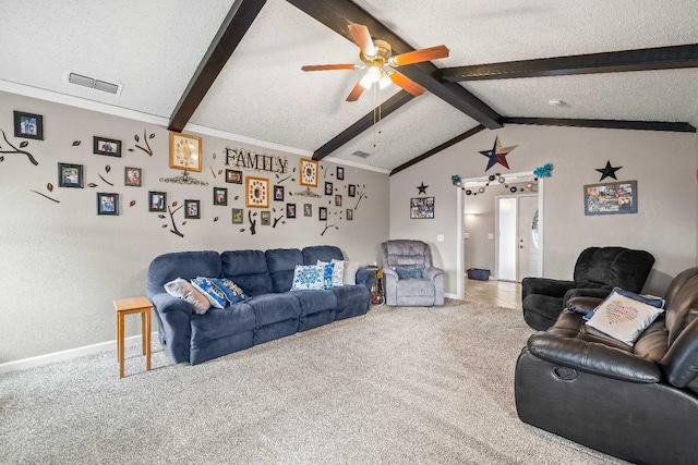 carpeted living room featuring ceiling fan, ornamental molding, vaulted ceiling with beams, and a textured ceiling