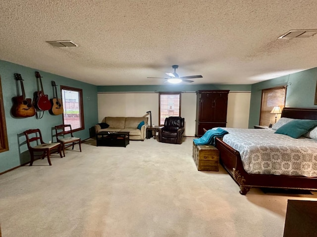 bedroom with light carpet and ceiling fan