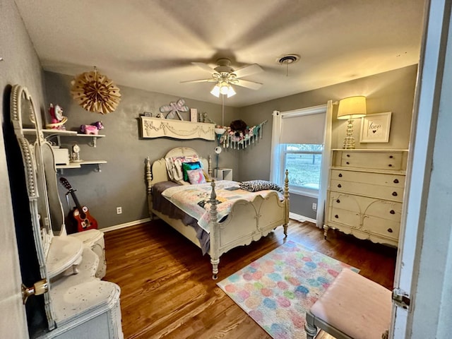 bedroom with dark wood-type flooring and ceiling fan