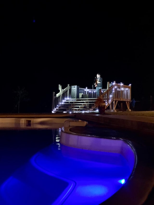 view of pool at night