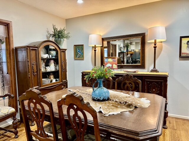 dining room with light hardwood / wood-style floors