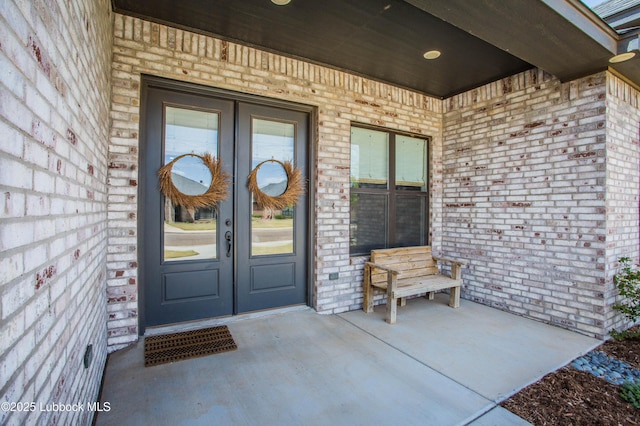 1308 Dover Ln, Wolfforth, TX 79382 - entrance to property featuring brick siding and french doors