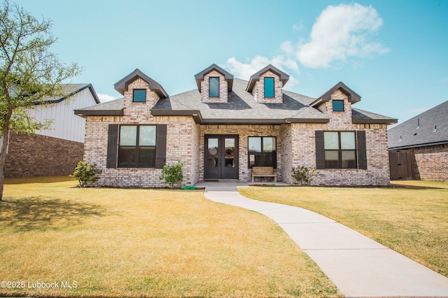 1308 Dover Ln, Wolfforth, TX 79382 - view of front of home with french doors, brick siding, and a shingled roof