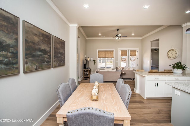 1308 Dover Ln, Wolfforth, TX 79382 - dining area with a ceiling fan, ornamental molding, dark wood-style flooring, recessed lighting, and baseboards