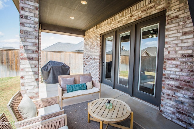 1308 Dover Ln, Wolfforth, TX 79382 - view of patio with grilling area, an outdoor hangout area, and french doors