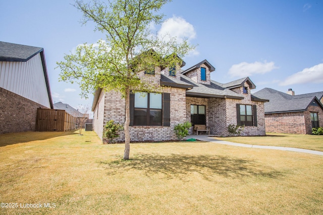 1308 Dover Ln, Wolfforth, TX 79382 - view of front facade featuring brick siding and a gate