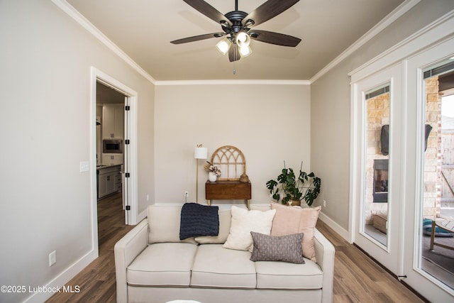 1308 Dover Ln, Wolfforth, TX 79382 - living area featuring ornamental molding, wood finished floors, ceiling fan, and baseboards