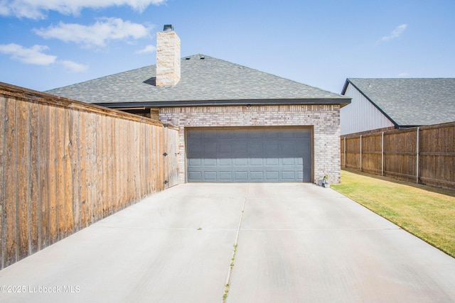 1308 Dover Ln, Wolfforth, TX 79382 - view of side of home with roof with shingles, brick siding, a chimney, and concrete driveway