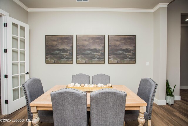 1308 Dover Ln, Wolfforth, TX 79382 - dining area with wood finished floors, ornamental molding, and baseboards