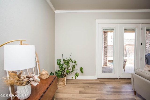 1308 Dover Ln, Wolfforth, TX 79382 - doorway featuring wood finished floors, crown molding, and baseboards