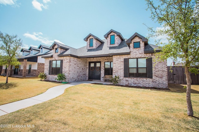 1308 Dover Ln, Wolfforth, TX 79382 - view of front of property with brick siding, french doors, and a shingled roof