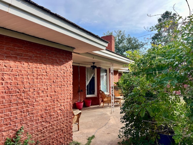 view of side of property with a patio area