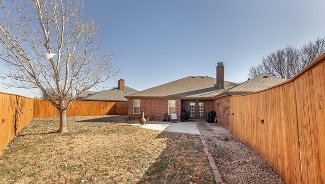 rear view of house featuring a patio