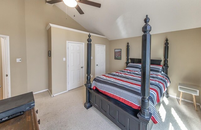 carpeted bedroom featuring vaulted ceiling and ceiling fan