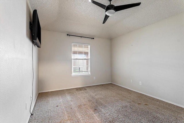 spare room featuring ceiling fan, a textured ceiling, and carpet flooring