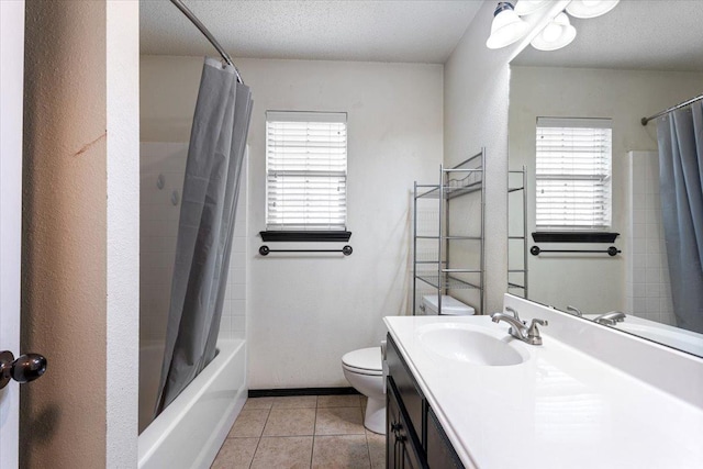 full bathroom with shower / bath combo, tile patterned flooring, vanity, a textured ceiling, and toilet