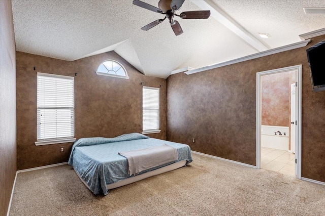 bedroom with vaulted ceiling, ensuite bathroom, carpet floors, ceiling fan, and a textured ceiling